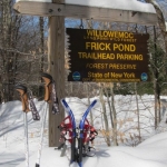 Frick trrailhead sign with snowshoes